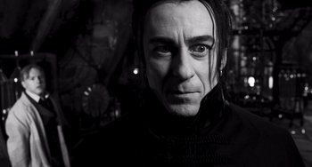 Movie still from “Van Helsing” (2004), directed by Stephen Sommers – A person wearing a black jacket; Close Up shot, Low angle