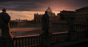 Movie still from “Van Helsing” (2004), directed by Stephen Sommers – A statue of a man standing in front of a building; Extreme Wide shot, High angle