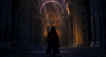Movie still from “Van Helsing” (2004), directed by Stephen Sommers – A man in a long coat and hat in an old church; Extreme Wide shot, Low angle
