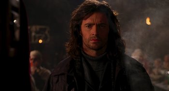Movie still from “Van Helsing” (2004), directed by Stephen Sommers – A person with long hair; Close Up shot, Low angle