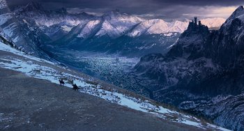 Movie still from “Van Helsing” (2004), directed by Stephen Sommers – A view of a mountain range with snow on the ground; Extreme Wide shot, High angle