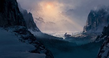 Movie still from “Van Helsing” (2004), directed by Stephen Sommers – A snowy mountain with a castle in the distance; Extreme Wide shot, Low angle