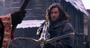 Movie still from “Van Helsing” (2004), directed by Stephen Sommers – A person holding a bow and arrow; Close Up shot, Over the shoulder angle