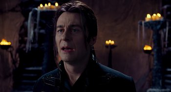 Movie still from “Van Helsing” (2004), directed by Stephen Sommers – A person with long brown hair; Close Up shot, Over the shoulder angle