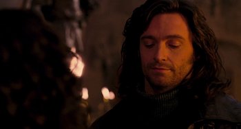 Movie still from “Van Helsing” (2004), directed by Stephen Sommers – A person with long dark hair; Close Up shot, Over the shoulder angle