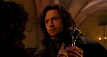 Movie still from “Van Helsing” (2004), directed by Stephen Sommers – A person holding a wrench; Close Up shot, Over the shoulder angle