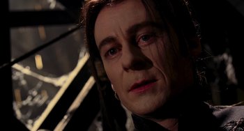 Movie still from “Van Helsing” (2004), directed by Stephen Sommers – A person with long brown hair; Close Up shot, Over the shoulder angle
