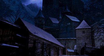 Movie still from “Van Helsing” (2004), directed by Stephen Sommers – A dark picture of some buildings in the dark; Extreme Wide shot, High angle