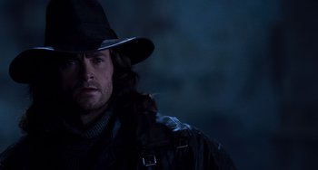 Movie still from “Van Helsing” (2004), directed by Stephen Sommers – A person wearing a hat; Close Up shot, Over the shoulder angle