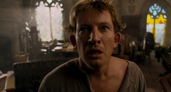 Movie still from “Van Helsing” (2004), directed by Stephen Sommers – A person wearing a shirt and looking at the camera; Close Up shot, Low angle
