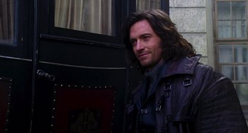 Movie still from “Van Helsing” (2004), directed by Stephen Sommers – A person with long brown hair; Close Up shot, Over the shoulder angle