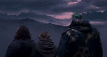 Movie still from “Van Helsing” (2004), directed by Stephen Sommers – A group of people standing on top of a hill; Extreme Wide shot, Over the shoulder angle