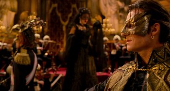 Movie still from “Van Helsing” (2004), directed by Stephen Sommers – A woman in a black dress and a man in a black suit; Medium shot, Over the shoulder angle