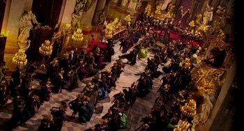 Movie still from “Van Helsing” (2004), directed by Stephen Sommers – A large group of people sitting on the ground; Extreme Wide shot, High angle