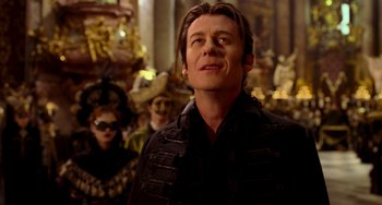 Movie still from “Van Helsing” (2004), directed by Stephen Sommers – A man standing in front of a group of people; Close Up shot, Low angle