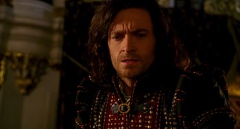 Movie still from “Van Helsing” (2004), directed by Stephen Sommers – A person wearing a costume; Close Up shot, Over the shoulder angle