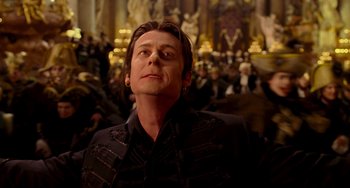 Movie still from “Van Helsing” (2004), directed by Stephen Sommers – A man in black jacket looking up at a crowd; Close Up shot, Low angle