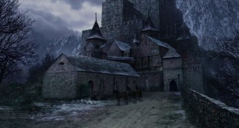 Movie still from “Van Helsing” (2004), directed by Stephen Sommers – An old castle with horses in front of it; Extreme Wide shot, Low angle
