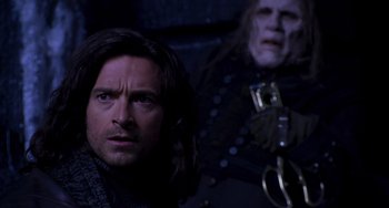 Movie still from “Van Helsing” (2004), directed by Stephen Sommers – A person and a person with a mask; Close Up shot, Over the shoulder angle