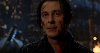Movie still from “Van Helsing” (2004), directed by Stephen Sommers – A person with blood all over his face; Close Up shot, Over the shoulder angle