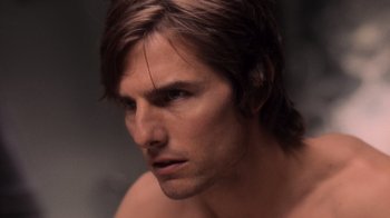 Movie still from “Vanilla Sky” (2001), directed by Cameron Crowe – A man's face in a dark room; Close Up shot, Over the shoulder angle