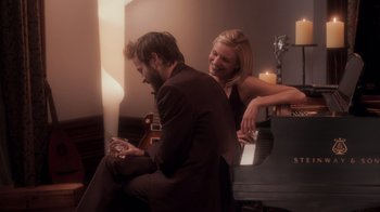 Movie still from “Vanilla Sky” (2001), directed by Cameron Crowe – A man and a woman sitting next to each other; Medium shot, High angle