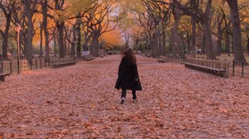 Movie still from “Vanilla Sky” (2001), directed by Cameron Crowe – A woman is walking down a path in the park; Extreme Wide shot, High angle