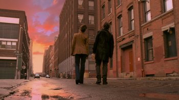 Movie still from “Vanilla Sky” (2001), directed by Cameron Crowe – Two people walking down a street holding hands; Wide shot, Over the shoulder angle