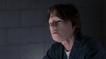 Movie still from “Vanilla Sky” (2001), directed by Cameron Crowe – A young man with long dark hair wearing a black shirt; Close Up shot, Low angle