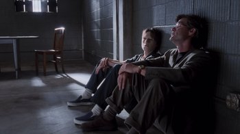 Movie still from “Vanilla Sky” (2001), directed by Cameron Crowe – Two people sitting on the ground in a room; Wide shot, Low angle