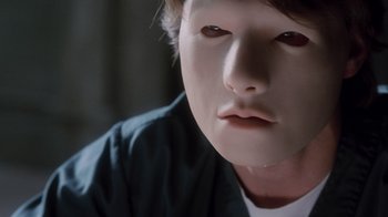 Movie still from “Vanilla Sky” (2001), directed by Cameron Crowe – A person's face in a mask; Close Up shot, High angle