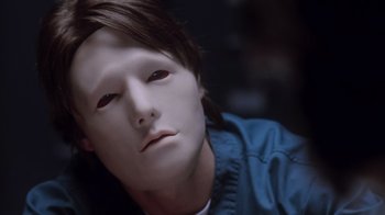 Movie still from “Vanilla Sky” (2001), directed by Cameron Crowe – A person's face in a mask; Close Up shot, High angle