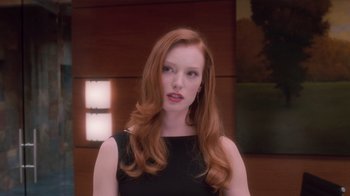 Movie still from “Vanilla Sky” (2001), directed by Cameron Crowe – A beautiful young woman with long red hair wearing a black dress; Close Up shot, Low angle