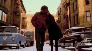 Movie still from “Vanilla Sky” (2001), directed by Cameron Crowe – A man and a woman walking down a street; Wide shot, Low angle