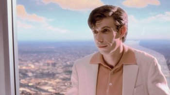 Movie still from “Vanilla Sky” (2001), directed by Cameron Crowe – A man in a pink shirt and white jacket looking at the camera; Close Up shot, Low angle