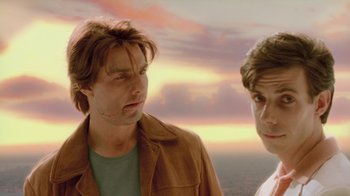 Movie still from “Vanilla Sky” (2001), directed by Cameron Crowe – Two men standing next to each other in front of a sunset; Close Up shot, Low angle
