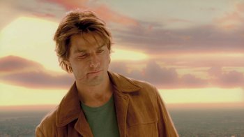 Movie still from “Vanilla Sky” (2001), directed by Cameron Crowe – A person wearing a brown jacket; Close Up shot, Low angle
