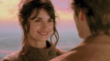 Movie still from “Vanilla Sky” (2001), directed by Cameron Crowe – A woman smiling at a man in a brown jacket; Close Up shot, Over the shoulder angle