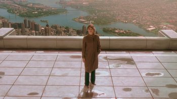 Movie still from “Vanilla Sky” (2001), directed by Cameron Crowe – A woman standing on the edge of a building with a view; Wide shot, High angle