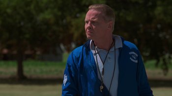Movie still from “Varsity Blues” (1999), directed by Brian Robbins – A person wearing a blue jacket; Close Up shot, Low angle