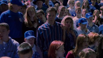 Movie still from “Varsity Blues” (1999), directed by Brian Robbins – A large group of people gathered together in a crowd; Medium shot, High angle