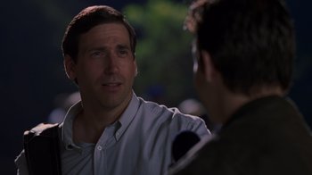 Movie still from “Varsity Blues” (1999), directed by Brian Robbins – A man talking to another man in front of a microphone; Close Up shot, Over the shoulder angle