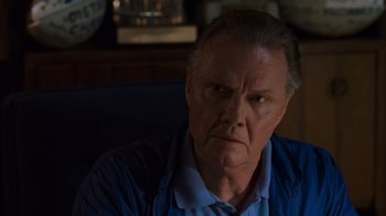 Movie still from “Varsity Blues” (1999), directed by Brian Robbins – An older man is looking at the camera; Close Up shot, Over the shoulder angle