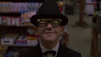 Movie still from “Varsity Blues” (1999), directed by Brian Robbins – A young man wearing a suit and a hat; Close Up shot, Low angle