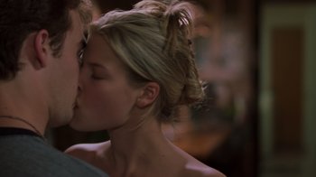 Movie still from “Varsity Blues” (1999), directed by Brian Robbins – A man and a woman kissing each other; Close Up shot, Over the shoulder angle