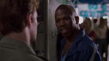 Movie still from “Varsity Blues” (1999), directed by Brian Robbins – A man talking to another man in front of a mirror; Close Up shot, Over the shoulder angle