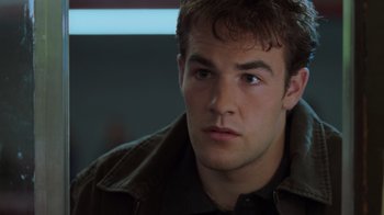 Movie still from “Varsity Blues” (1999), directed by Brian Robbins – A person wearing a jacket; Close Up shot, Over the shoulder angle