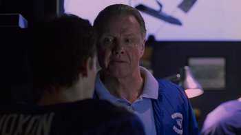 Movie still from “Varsity Blues” (1999), directed by Brian Robbins – An older man is looking at a younger man; Close Up shot, Low angle