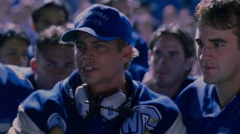 Movie still from “Varsity Blues” (1999), directed by Brian Robbins – A group of men standing next to each other; Close Up shot, Over the shoulder angle