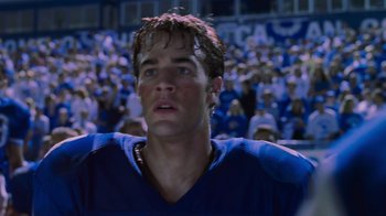 Movie still from “Varsity Blues” (1999), directed by Brian Robbins – A football player in a crowd; Close Up shot, Low angle
